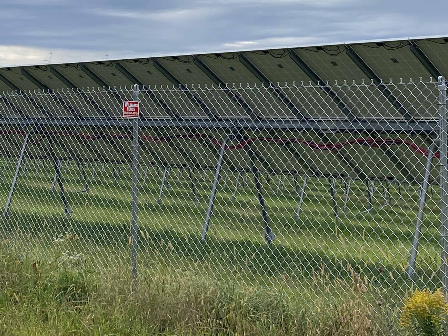 Photo of a Central NY chain link fence around a solar field